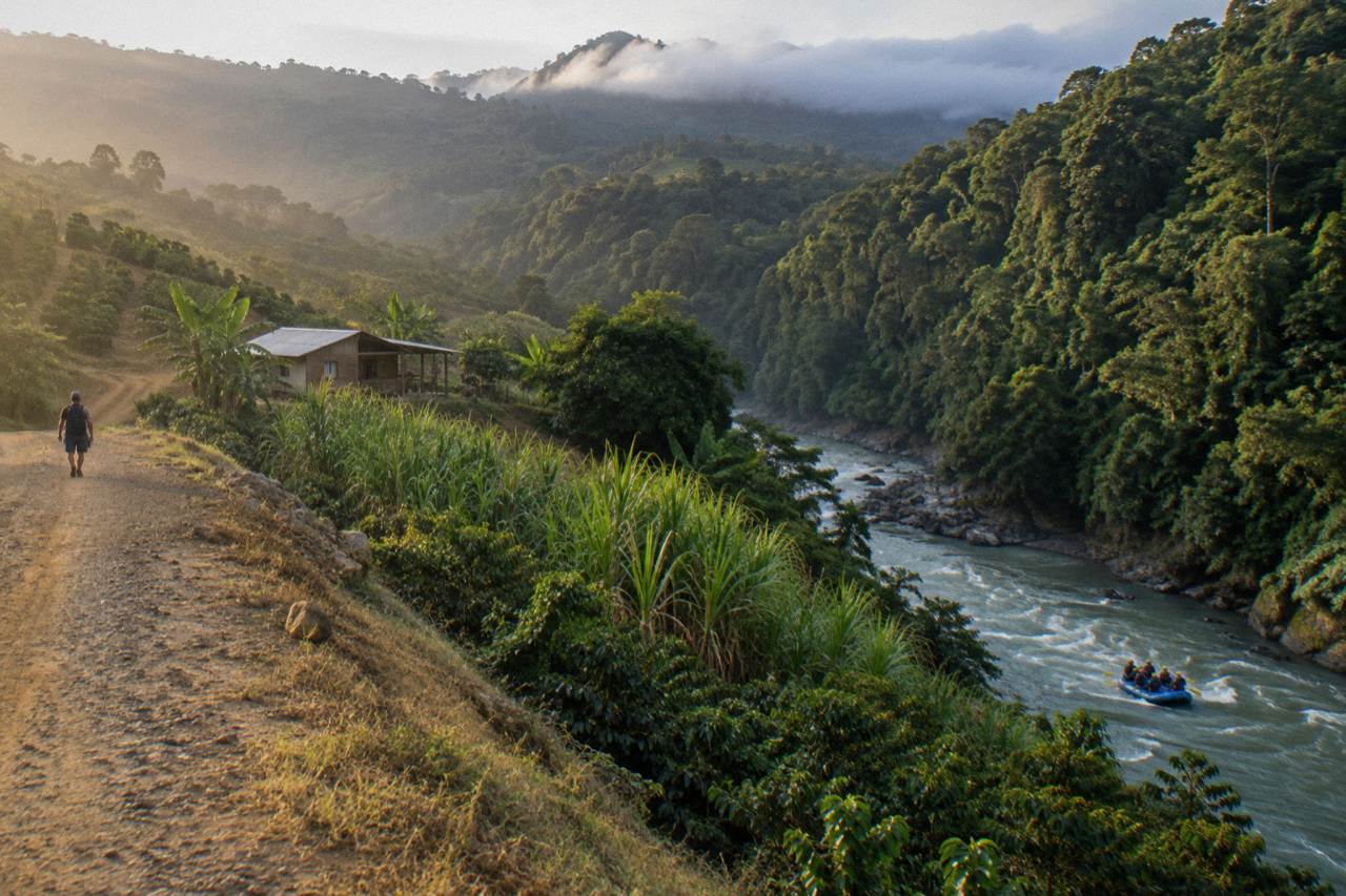 Green valley and volcano slopes seen from a hillside road near Turrialba